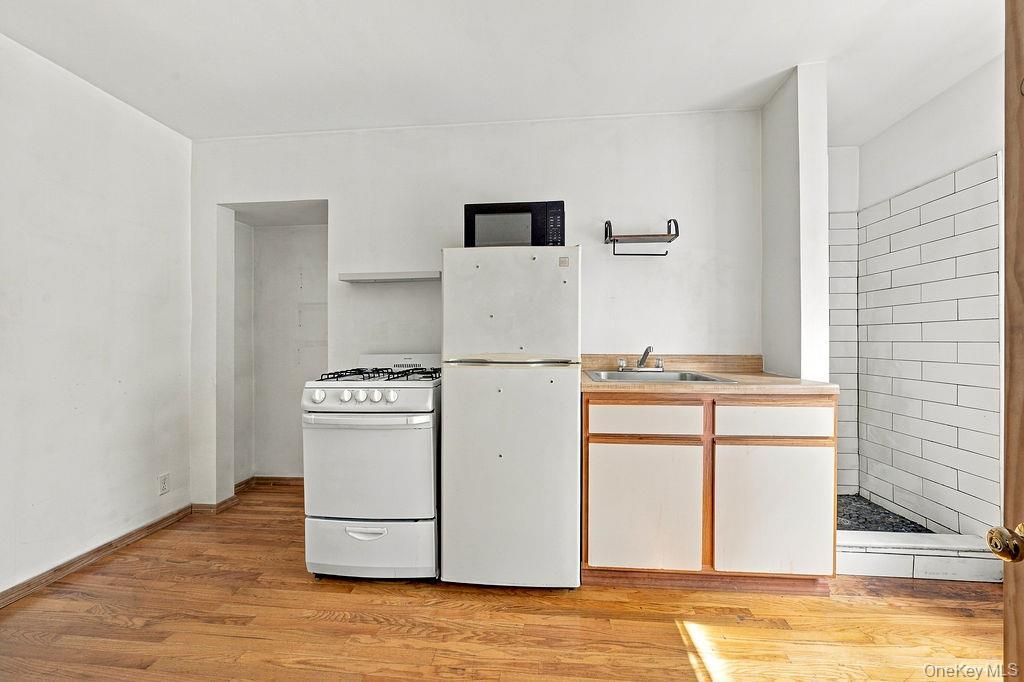 Single Family Devoe Street  Brooklyn, NY 11211, MLS-1055840-14